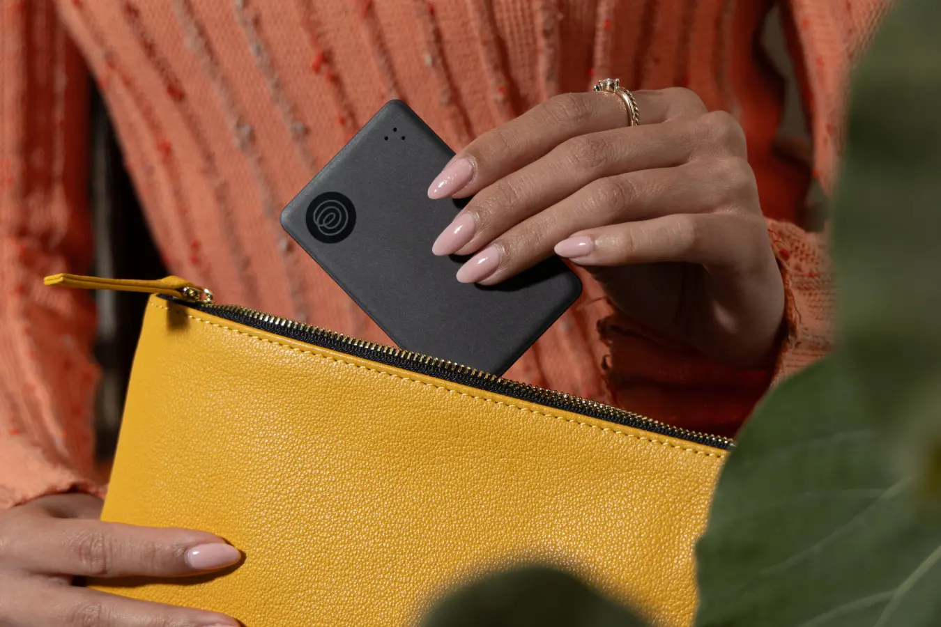 Image of Tile Slim- Black being placed into a yellow bag