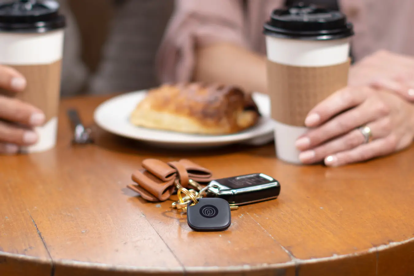 Image of Tile- Black on a keychain on a table