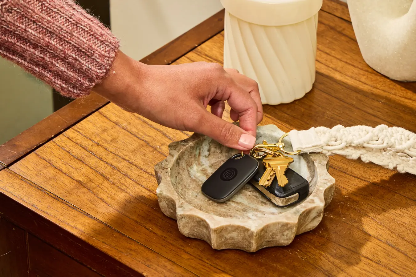 Image of Tile Pro- Black on a keychain in a bowl