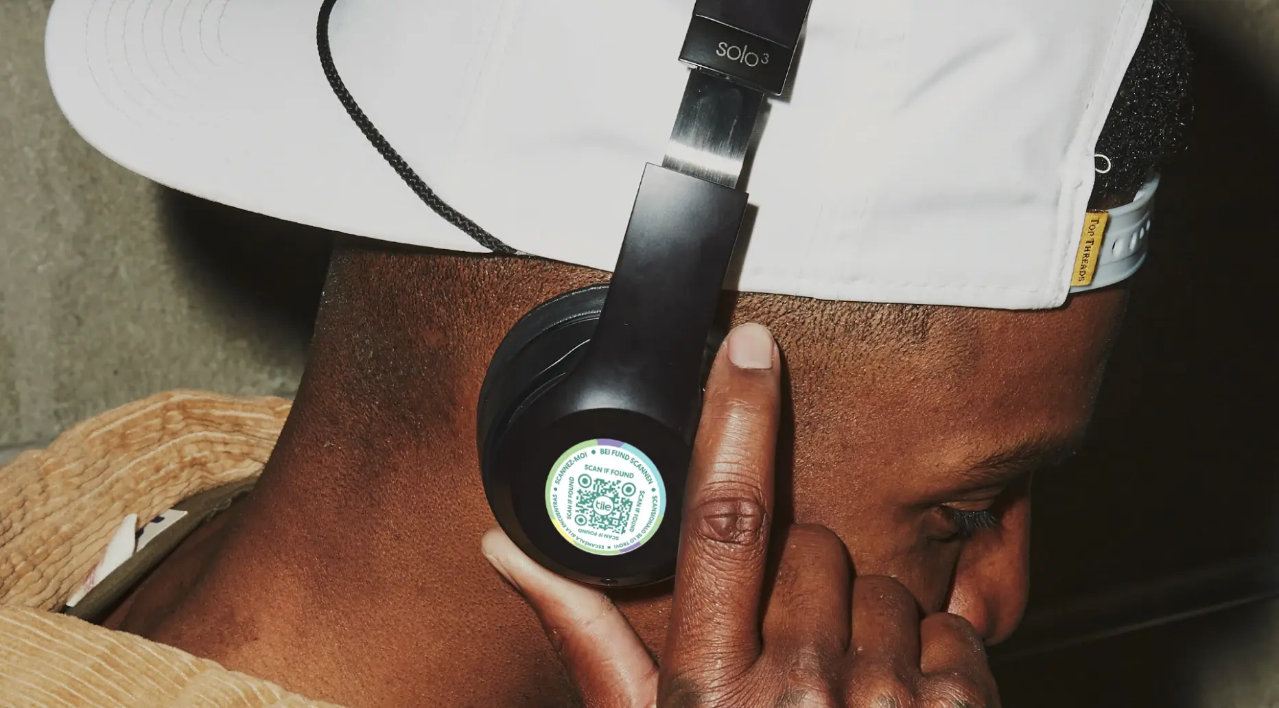 A Lost and Found Label on a pair of black headphones.