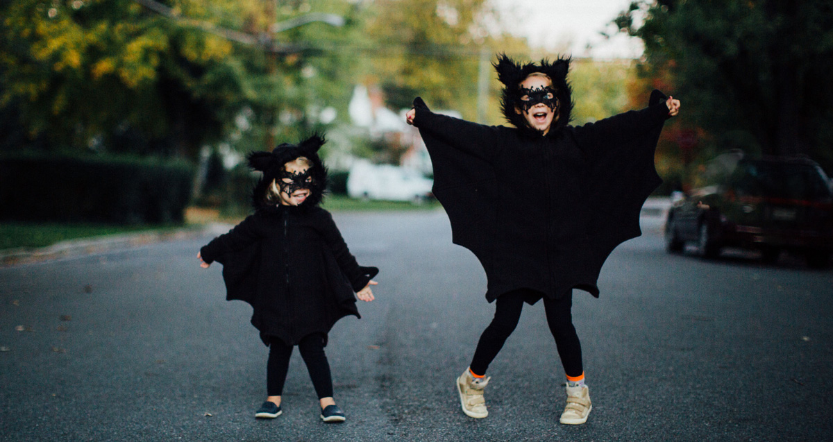 Two girls dressed as bats on Halloween