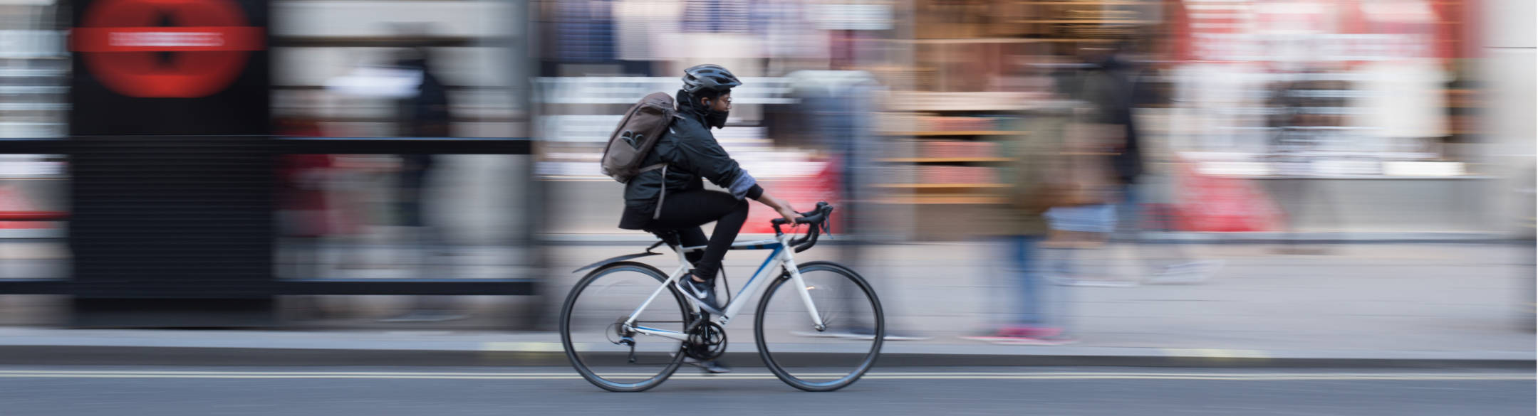 Bike rider on busy city street