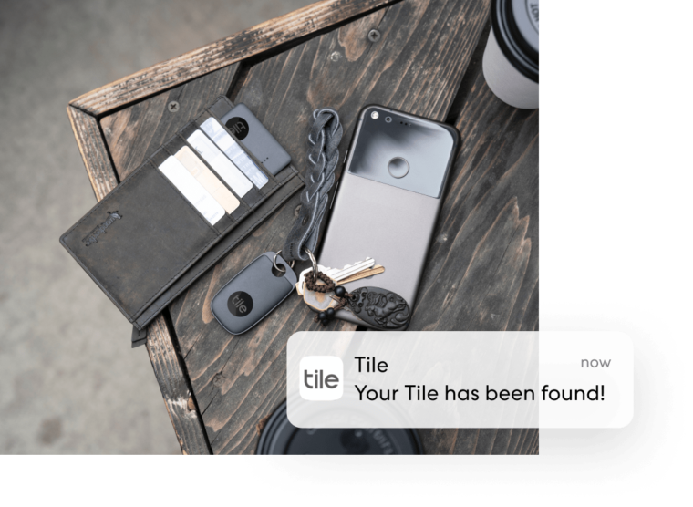 Tile on keys and wallet with Tile 'Your Tile has been found' notification